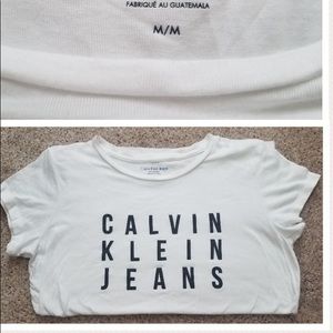 a white and black tee